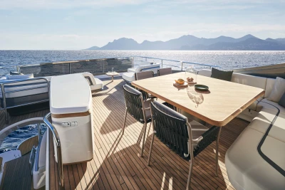 Luxurious deck of 2026 Princess X80 yacht with ocean view and elegant seating.