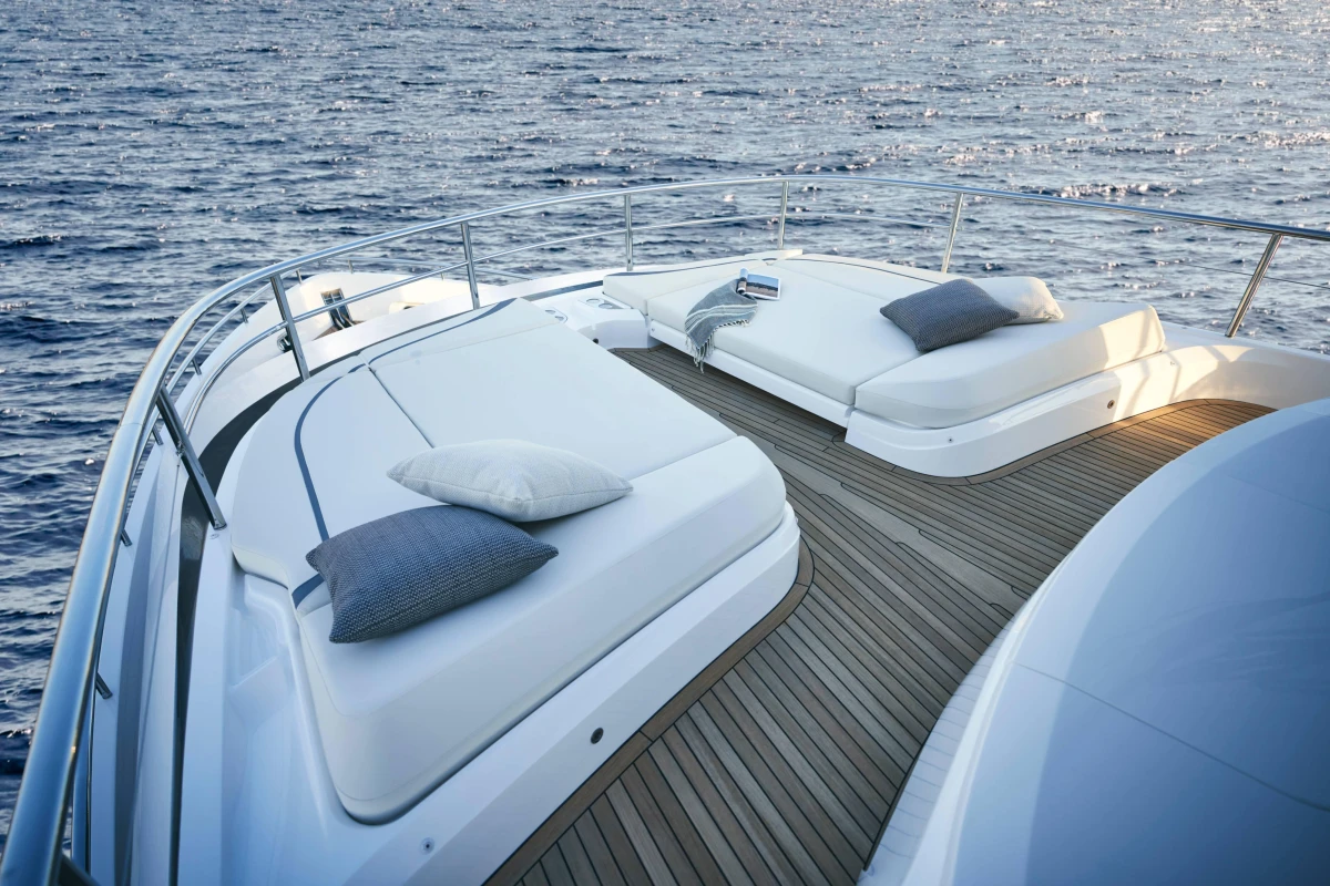 Luxurious 2026 Princess X80 yacht deck with sun loungers and ocean view.