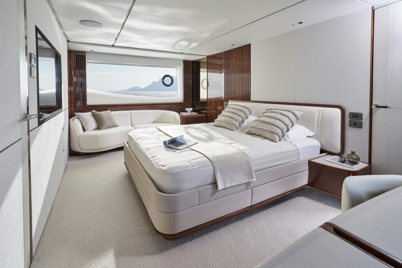 Luxurious bedroom interior on 2026 Princess X80 yacht, featuring elegant design and ocean view.