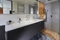 Luxurious bathroom in 2026 Princess X80 yacht with modern fixtures and dual sinks.