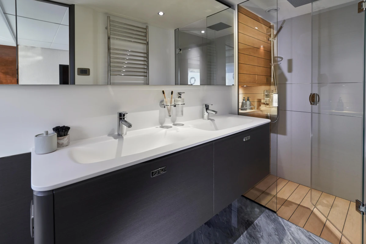 Luxurious bathroom in 2026 Princess X80 yacht with modern fixtures and dual sinks.
