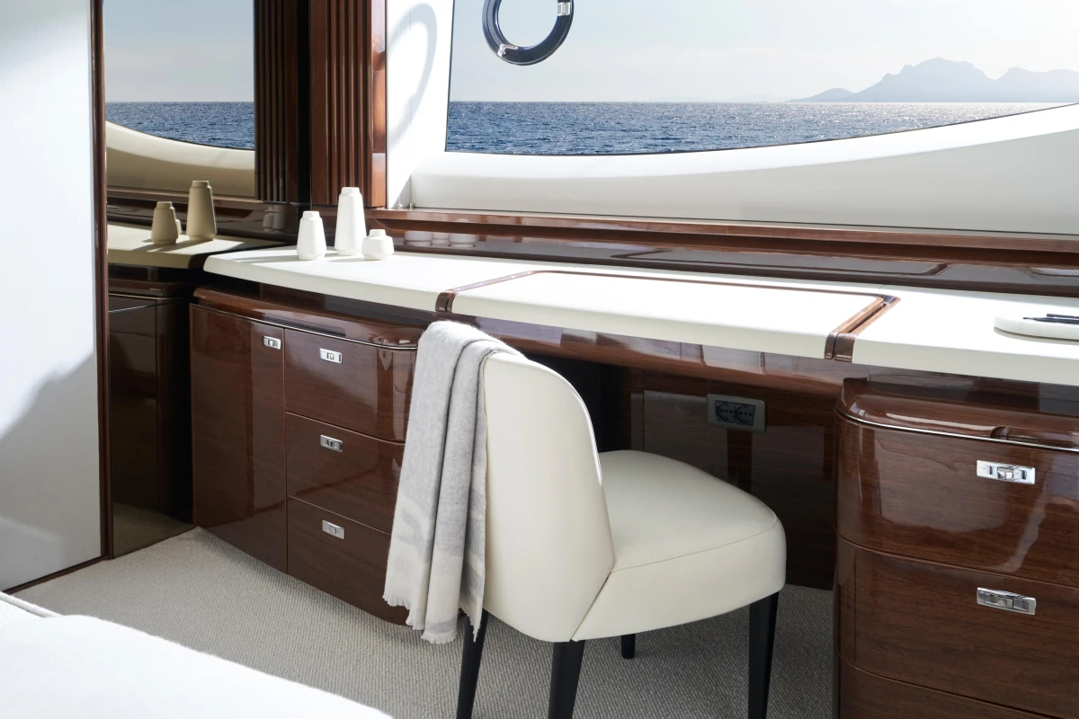 Luxurious interior of 2026 Princess X80 yacht with elegant wood finish and ocean view.