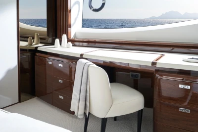 Luxurious interior of 2026 Princess X80 yacht with elegant wood finish and ocean view.
