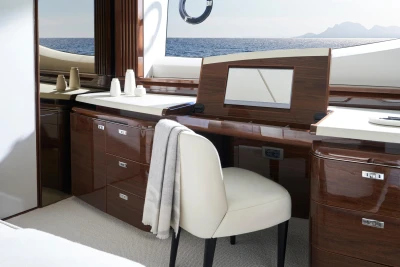 Luxurious interior of 2026 Princess X80 yacht with elegant wood finish and ocean view.