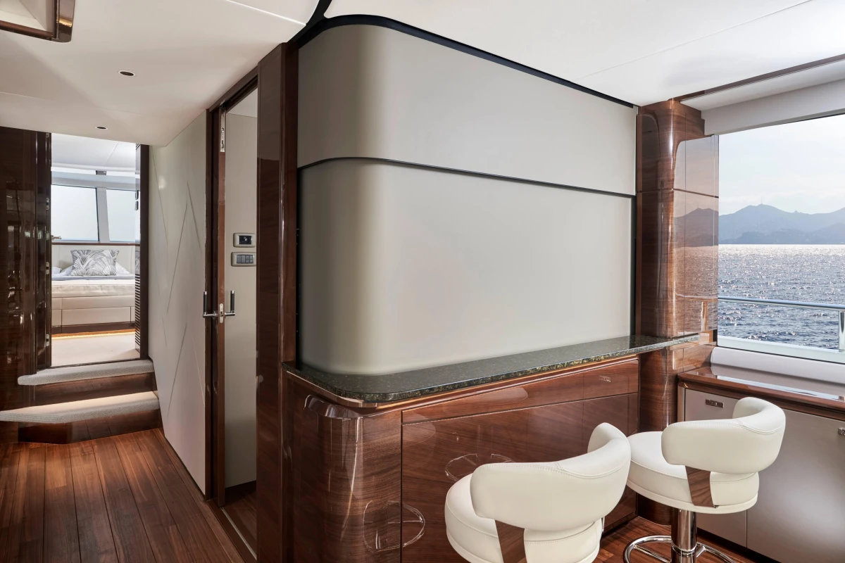 Luxurious interior of 2026 Princess X80 yacht with elegant bar and ocean view.