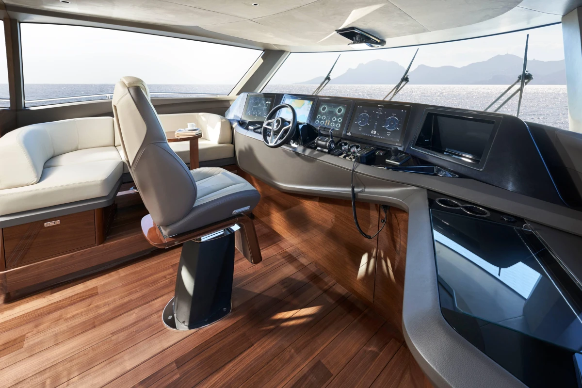 Luxurious 2026 Princess X80 yacht interior with modern helm and seating area.