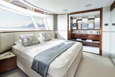 Luxurious bedroom interior of 2026 Princess X80 yacht with ocean view.